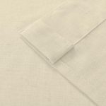 Cream-colored wedding table linen fabric with neatly folded edges, perfect for wedding decor and event styling.
